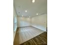 Spacious living room featuring plush carpet and ample natural light from a large window at 353 Jetton St, Davidson, NC 28036