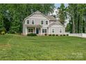 Two-story home with a lush green lawn and a classic design at 360 Sundown Rd, Mooresville, NC 28117