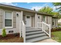 Inviting front porch with decorative columns and detailed trim surrounding the main entrance at 3801 Rea Rd, Charlotte, NC 28226