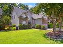 Charming home featuring a stone and vinyl exterior, well-manicured lawn, and a two-car garage at 4121 Cedar Point Ave # 28, Stallings, NC 28104