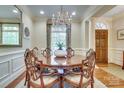 Chandelier-lit dining room featuring a round table and large window at 525 Queens Rd, Charlotte, NC 28207