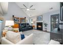 Inviting living room features a fireplace, large area rug, and comfortable seating for relaxing evenings at 5927 Leawood Run Ct, Charlotte, NC 28269