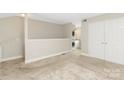 Spacious bonus room with a laundry closet, neutral carpet, and access to an attic space at 6101 Heath Ridge Ct, Charlotte, NC 28210