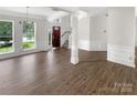 Spacious living room featuring hardwood floors and ample natural light at 6413 Fillian Ln, Charlotte, NC 28269