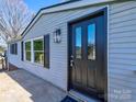 Close up of home's front door and shuttered windows at 1038 Gold Mine Dr, Catawba, NC 28609