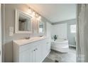 Bright bathroom with double sinks and a separate soaking tub, offering a spa-like experience at 110 Crescent Heights Dr, Salisbury, NC 28146