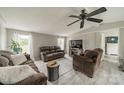 Inviting living room with neutral walls, ceiling fan, and comfortable brown furniture, perfect for relaxing and entertaining at 110 Crescent Heights Dr, Salisbury, NC 28146