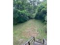 A large, sloping backyard offers ample space for outdoor activities and gardening at 114 Wayne Ave, Kannapolis, NC 28081