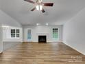 Bright living room with fireplace, and hardwood floors at 12307 Poplar Forest Dr, Charlotte, NC 28278