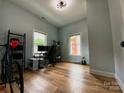 Cozy bedroom featuring hardwood floors, a neutral color palette, and natural lighting at 125 Todd Nw Dr, Concord, NC 28025