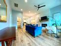 Bright and open living room featuring modern decor, fireplace, and hardwood flooring at 125 Todd Nw Dr, Concord, NC 28025