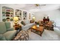 Comfortable living room with built-in bookshelves and ample seating for relaxing and entertaining at 1518 Appaloosa Way, Gastonia, NC 28056