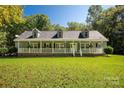 Charming one-story home with a welcoming front porch and well-manicured lawn at 1738 Charlotte Hwy, Lancaster, SC 29720