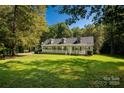 Inviting one-story home with a spacious front porch and lush green lawn at 1738 Charlotte Hwy, Lancaster, SC 29720