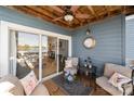 Enjoy the tranquil balcony with comfortable furniture, water views, and stylish decor at 18679 Vineyard Point Ln, Cornelius, NC 28031