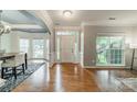 Elegant foyer with gleaming hardwood floors, decorative molding, and an abundance of natural light at 211 Tyndale Ct, Waxhaw, NC 28173