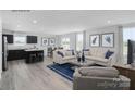 Bright and airy living room featuring modern furniture, hardwood floors, and an open-concept design at 231 Basildon St # 1021, Lancaster, SC 29720