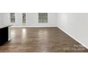 Spacious open floorplan with sleek, continuous hardwood flooring throughout at 2618 Mt Holly Huntersville Rd, Charlotte, NC 28214