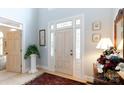 Bright foyer showcases a leaded-glass door, white column with plant, and light hardwood floors at 2972 Kaneland Ct, Rock Hill, SC 29732