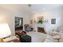 Cozy living room boasts a brick fireplace, light-colored walls, and comfortable furnishings at 2972 Kaneland Ct, Rock Hill, SC 29732