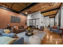 Spacious living area featuring hardwood floors, modern decor, and an open layout at 310 Arlington Ave # 409, Charlotte, NC 28203