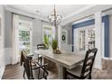Elegant dining room with modern lighting, wood flooring, and large windows providing plenty of natural light at 362 Windell Dr # 67, Fort Mill, SC 29708