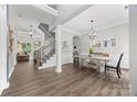 Welcoming entryway features wood flooring, a staircase, and elegant light fixtures. Dinning area is also pictured at 362 Windell Dr # 67, Fort Mill, SC 29708