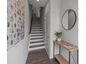 Welcoming foyer area featuring a staircase with a modern design and stylish decorations at 3737 S Tryon St, Charlotte, NC 28217