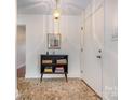 Inviting foyer with decorative tile flooring and a stylish light fixture at 4044 Somerdale Ln, Charlotte, NC 28205