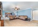 A cozy living room featuring a comfortable sectional sofa and open access to the kitchen at 4518 Logging Rd, Lancaster, SC 29720
