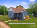 Charming home featuring a brick exterior, updated roof, and freshly painted trim at 506 N Styers St, Cherryville, NC 28021