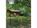 Charming single story home featuring a wood exterior and a lush green front yard at 823 Corbin St, Albemarle, NC 28001
