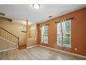 Inviting living room with wood-look flooring and ample natural light at 9564 Kings Parade Blvd, Charlotte, NC 28273