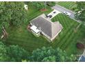 Aerial view of home with an enclosed patio and manicured lawn at 104 Laura Ct, Cherryville, NC 28021