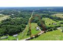 Aerial view of the expansive property, surrounded by lush greenery and featuring clearly defined lot lines at 117 Autumn Woods Dr, Kings Mountain, NC 28086