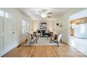Bright living room featuring hardwood floors, ceiling fan, neutral decor, and modern furnishings at 1188 Rainbow Cir, Catawba, SC 29704