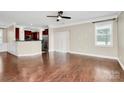 Bright living room featuring hardwood floors and sliding glass doors to the outside at 13407 Morgan Lee Ave, Charlotte, NC 28213