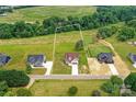 Expansive aerial view of a home with a large lot, surrounded by lush greenery and neighboring houses at 181 Lone Pine Rd, Statesville, NC 28625