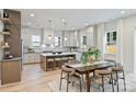 Well-lit kitchen featuring a center island with seating, ample counter space, and modern pendant lighting at 1834 Arnold Dr, Charlotte, NC 28205