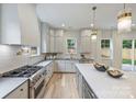 Modern kitchen with stainless steel appliances, sleek countertops, and ample cabinet space at 1834 Arnold Dr, Charlotte, NC 28205