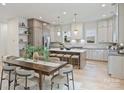 Bright, open kitchen with a large island, modern appliances, and a stylish dining area at 1834 Arnold Dr, Charlotte, NC 28205