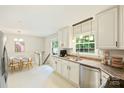 Bright kitchen features granite countertops, stainless steel appliances, and adjoining breakfast nook at 2301 Seth Thomas Rd, Charlotte, NC 28210