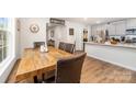 View of the dining room with a wooden table, leather chairs, and a glimpse into the kitchen at 2317 Trollinger Dr, Catawba, NC 28609