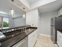 Open-concept kitchen featuring granite countertops, stainless steel appliances, and a breakfast bar at 300 W 5Th St # 339, Charlotte, NC 28202