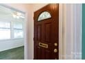 Elegant wood front door with decorative glass and brass hardware leading inside at 441 Jackson St, Rock Hill, SC 29730