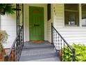 Charming green front door with decorative glass and wrought iron railings at 441 Jackson St, Rock Hill, SC 29730