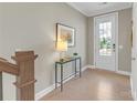 Bright entryway with hardwood floors, console table, and decor at 5060 Harrowsmith Ln, Charlotte, NC 28204