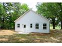 The backyard has a newly installed patio area and freshly laid sod, perfect for outdoor entertaining at 617 English St, Monroe, NC 28110
