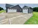 Spacious driveway leading to a detached two-car garage at 7133 Church Rd, Taylorsville, NC 28681