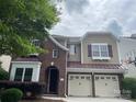 Charming two-story brick and siding home with a two-car garage and manicured landscaping at 9429 Ridgeforest Dr, Charlotte, NC 28277